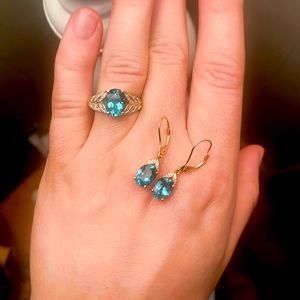 Blue topaz and gold ring and earrings set.